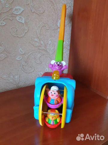 Детская игрушка - каталка 