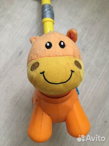 Игрушка каталка музыкальная Игрушка каталка музыкальная